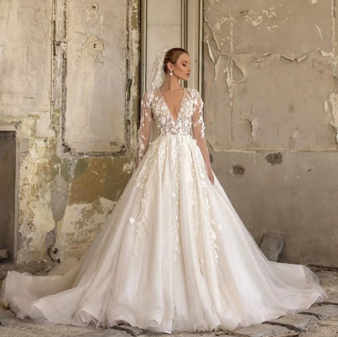 Elegant Deep V-neck Wedding Dress with Appliques, Lace, Ruffles, and Tulle